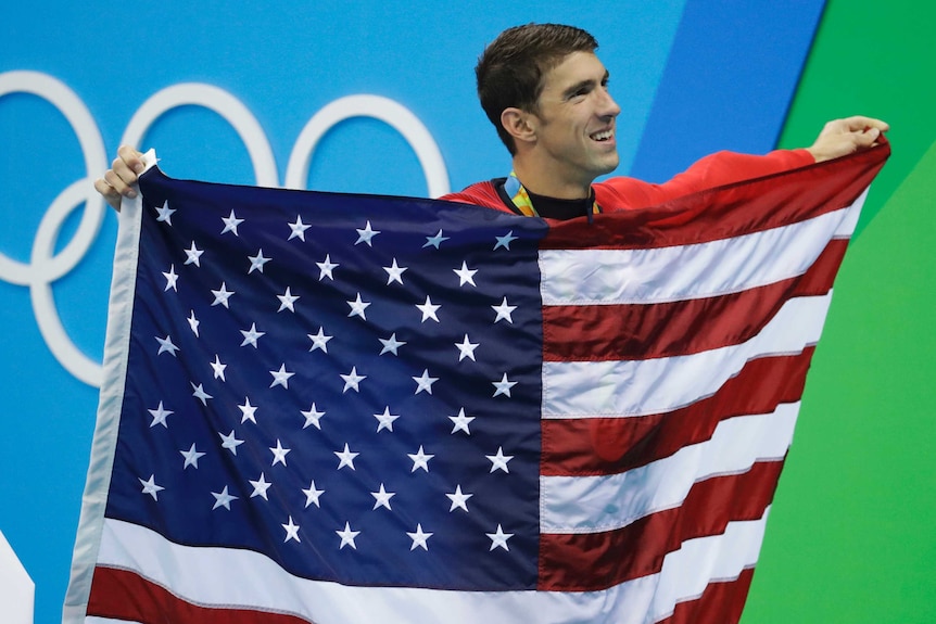 Michael Phelps celebrates winning his 23rd Olympic gold medal