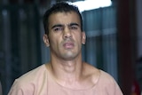Bahraini soccer player Hakeem al-Araibi dressed in Thai prison garb