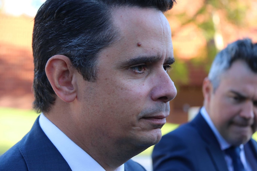 A tight side-on head shot of WA Treasurer Ben Wyatt during a media conference.