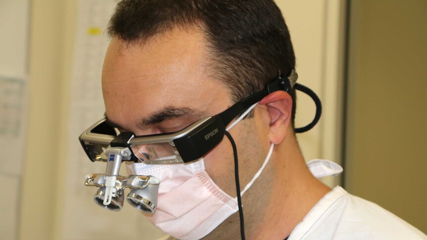 Close up of dentist wearing augmented reality headset
