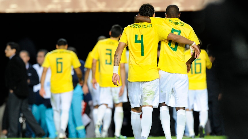 Brazilian players Thiago Silva and Ramires leave the field together after loss.