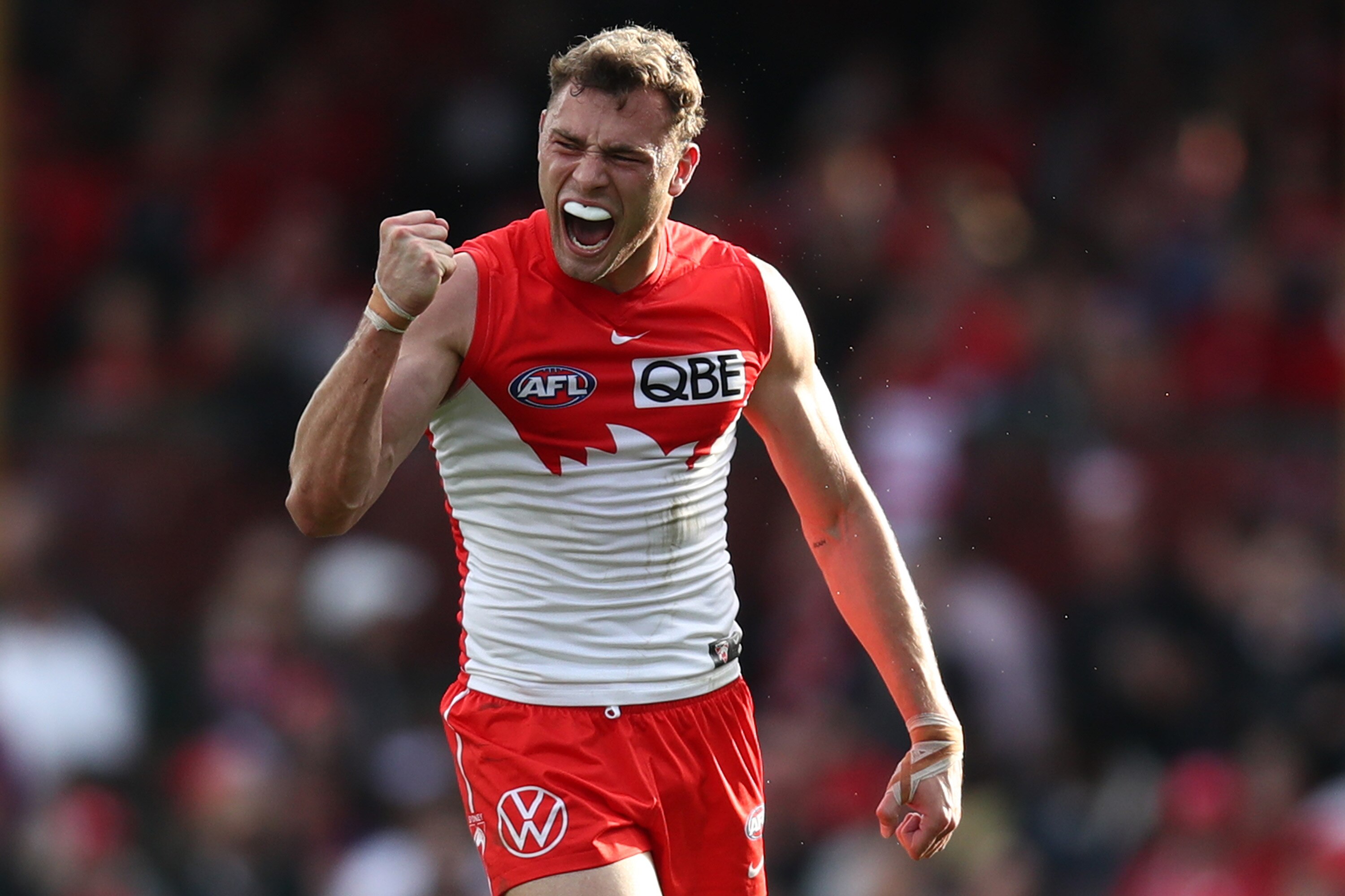 Will Hayward pumps his fist and yells in delight