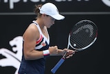 Ash Barty pumps her fist after winning a game in her Sydney International quarter-final.
