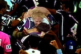 Bulldogs player James Graham appears to bite Storm player Billy Slater.