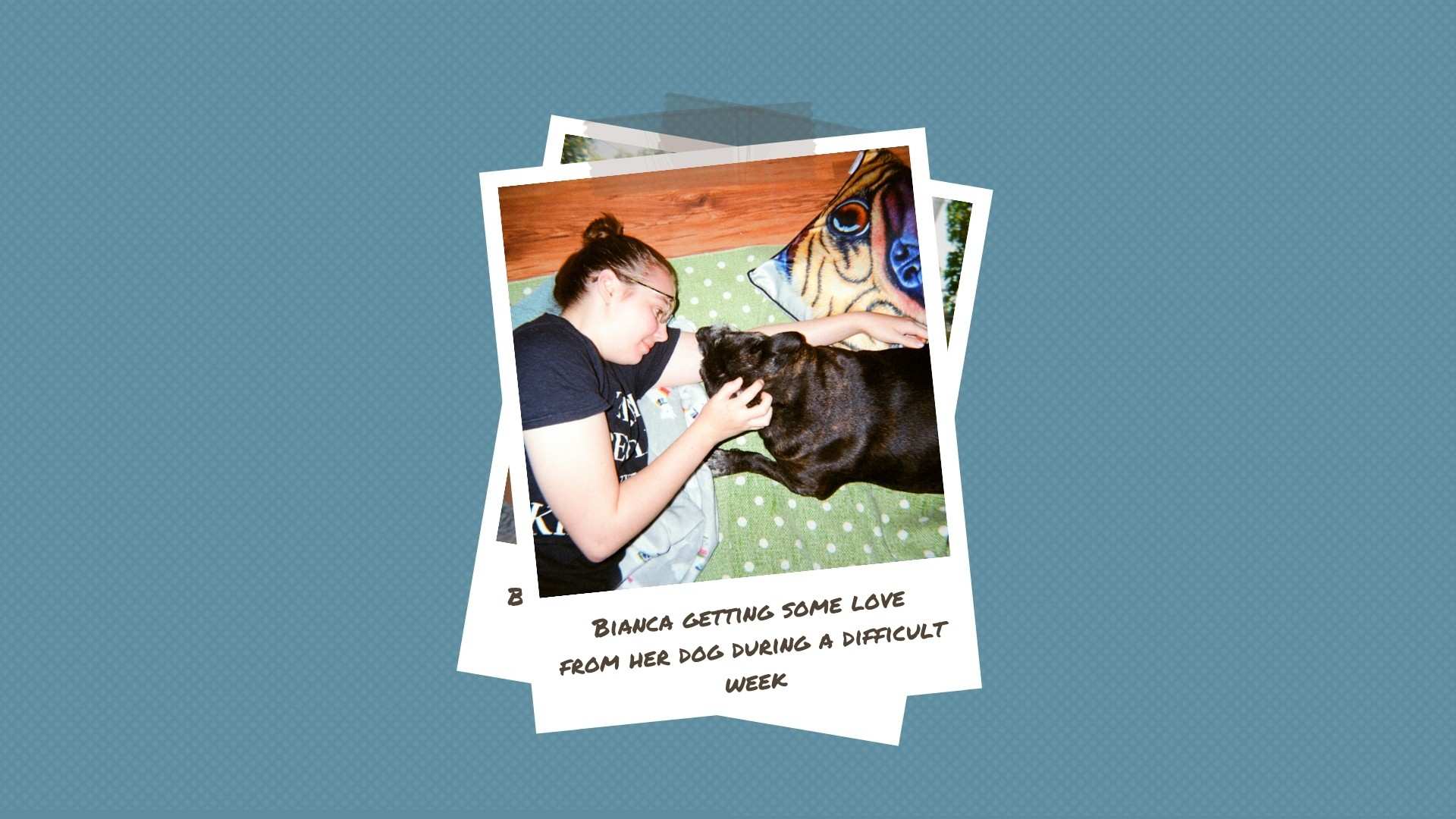 A young woman lies on the floor with her dog