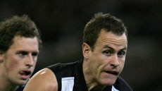 James Clement gains possession for Collingwood
