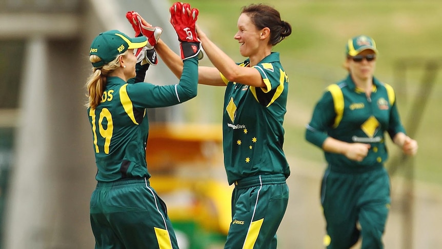 Julie Hunter (R) celebrates a wicket during the women's one-day international match between Australian and New Zealand.