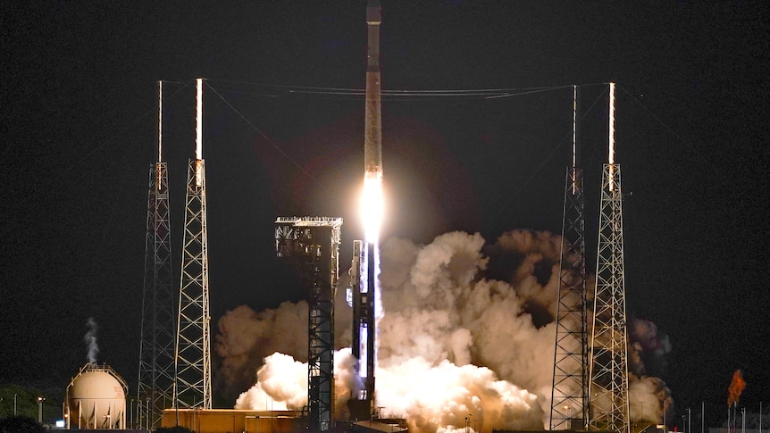 The Atlas V rocket carrying the Lucy spacecraft launches from Cape Canaveral in a cloud of dust and smoke