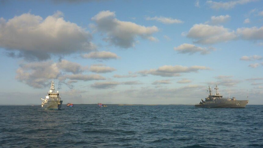 Navy brings in the Vietnamese fishing vessels.