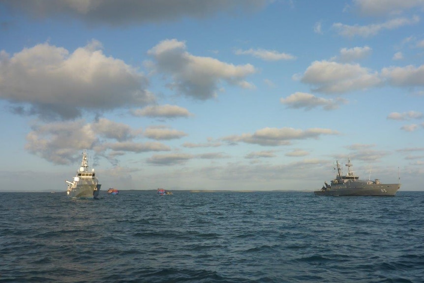 Navy brings in the Vietnamese fishing vessels.