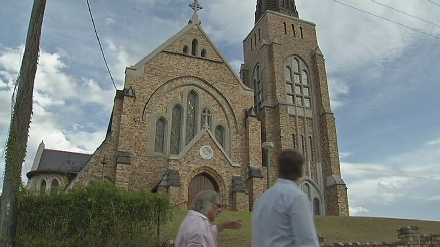 Tommy Campion and Todd Yourell walk around the Lismore Anglican Church