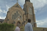 Tommy Campion and Todd Yourell walk around the Lismore Anglican Church