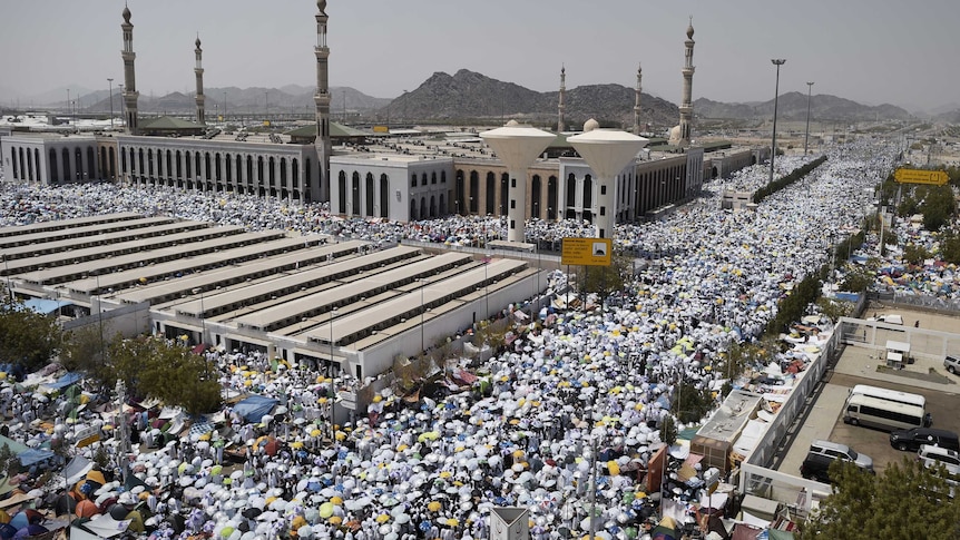 Muslim pilgrims gather to perform noon and afternoon prayers at Namira Mosque in Mount Arafat, southeast of the Saudi holy city of Mecca