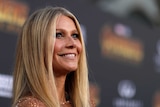 Actress Gwyneth Paltrow smiles on the red carpet at the movie premiere