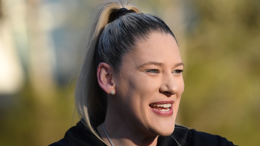 A retired Australian female basketballer speaks to the media in Canberra in 2019.
