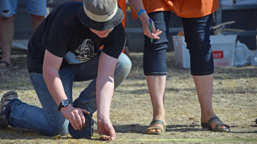 Damper throw being measured