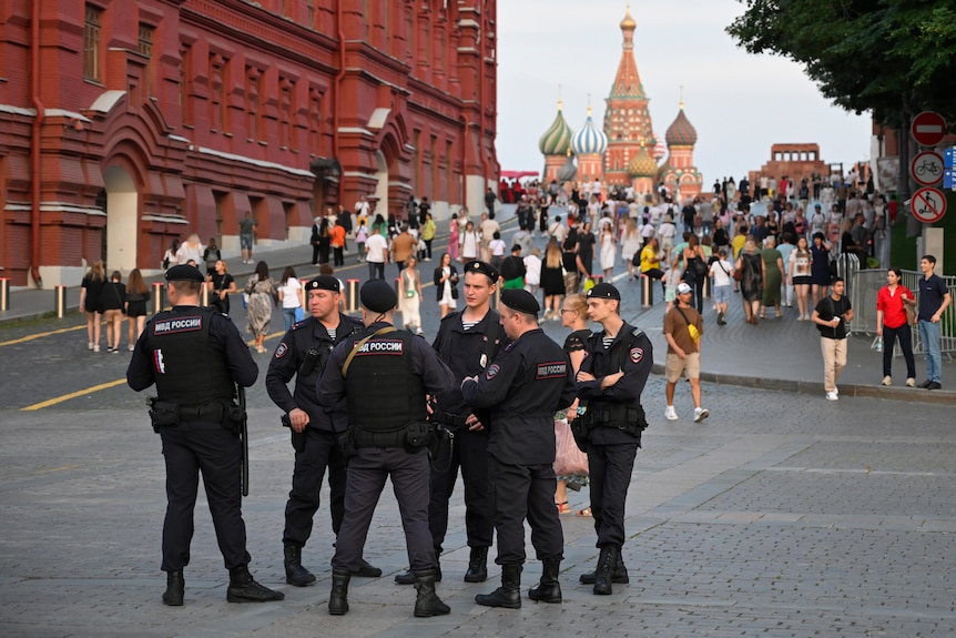 Police officers stand near the Red Square in Moscow.