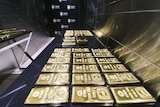 A table with bars of gold on it inside a vault in Sydney.