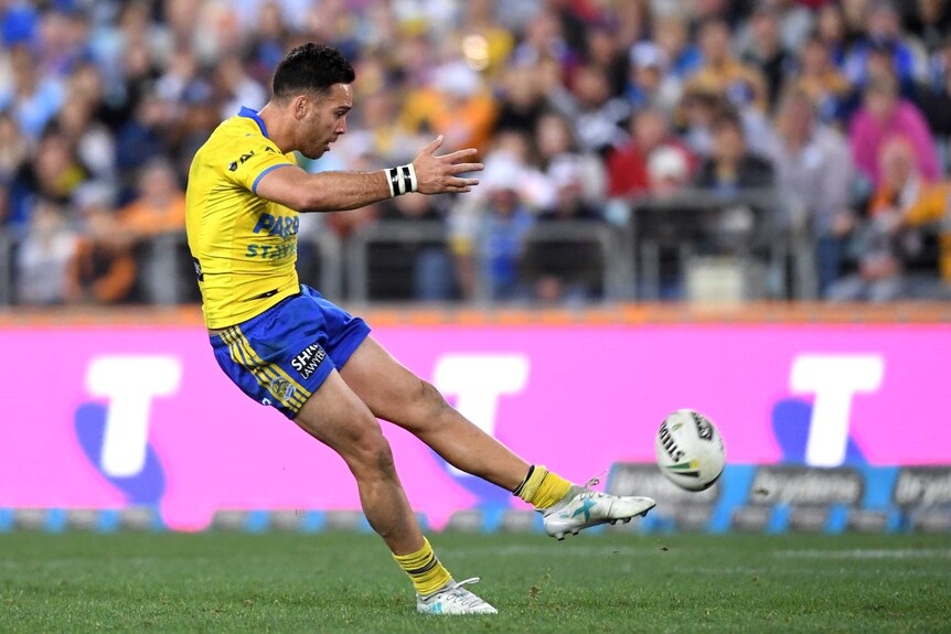 Corey Norman strikes the winning field goal for Parramatta against the Tigers.