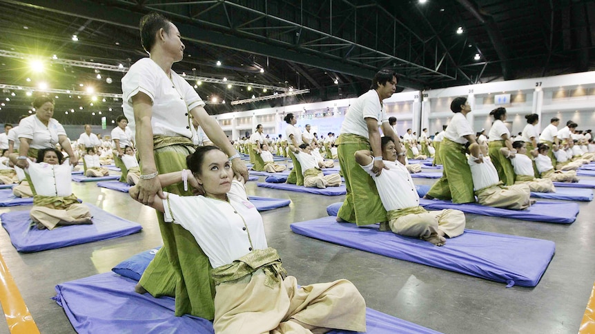 1,282 people in Bangkok have smashed Australia's record for the biggest group massage.