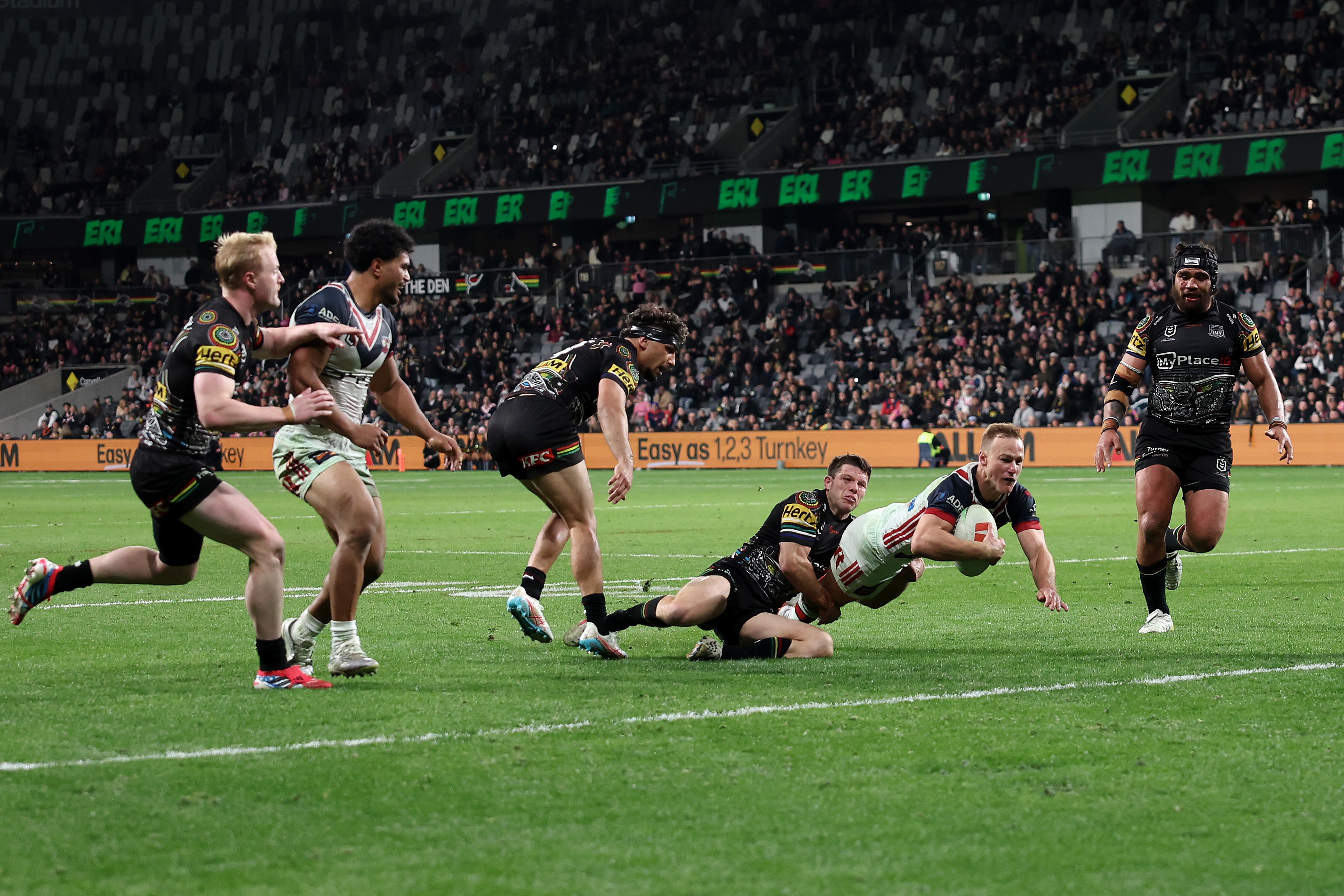 A man scores a try in a rugby league match