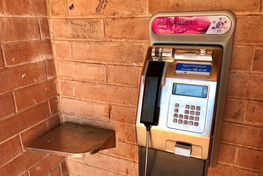 A Telstra payphone fixed to a wall