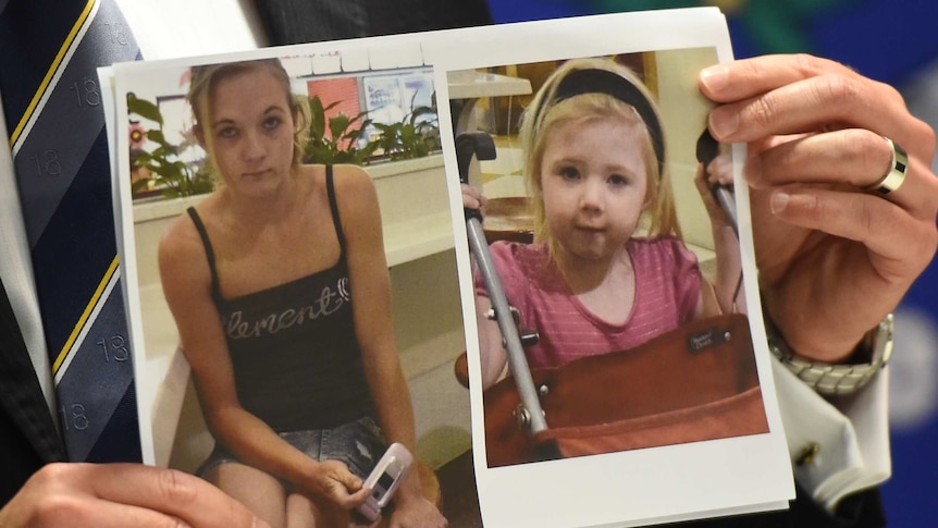 Police hold photo of murdered mother and child