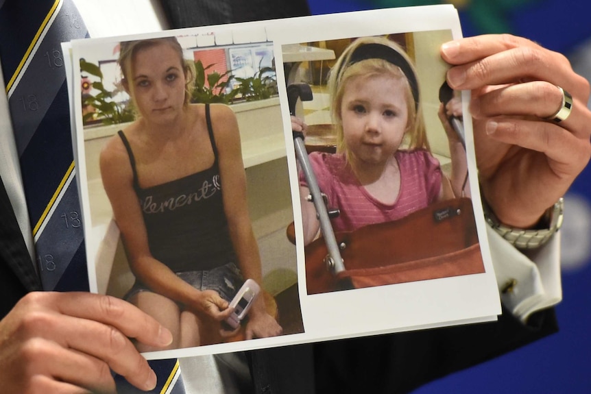 Police hold photo of murdered mother and child