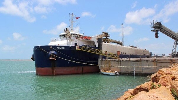 boat at port getting mining exports