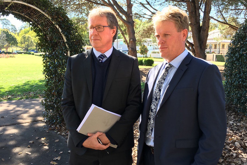 Shine Lawyers special counsel Peter Shannon and lead plantiff Brad Hudson speak to media in Toowoomba
