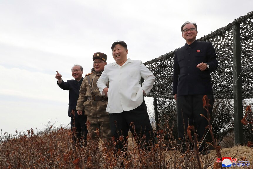 Kim Jong Un supervises a test launch of a cruise missile.