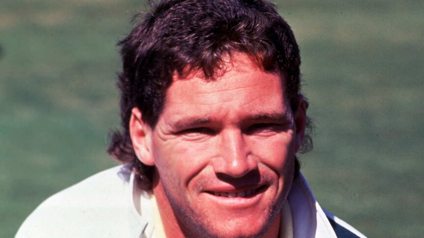 A Former Australian Test cricketer poses for a photograph in training gear.