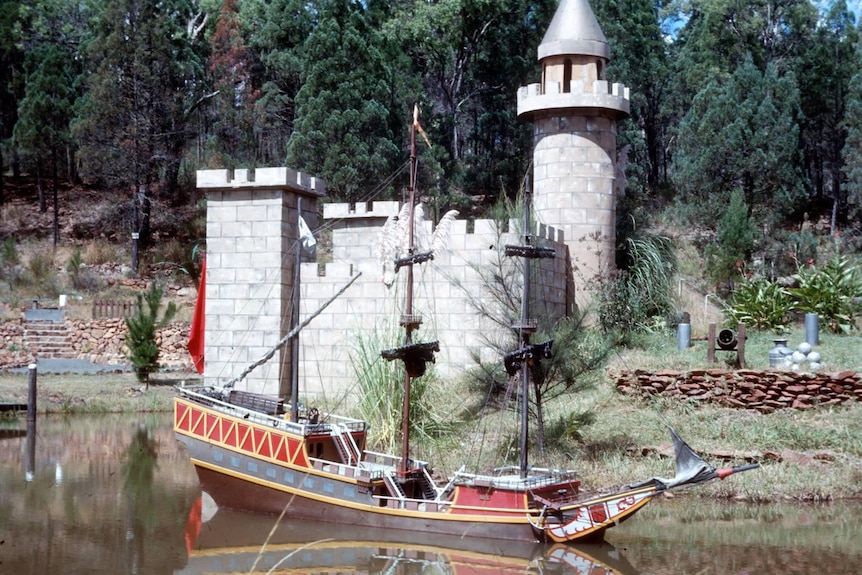 a castle and boat theme park attraction