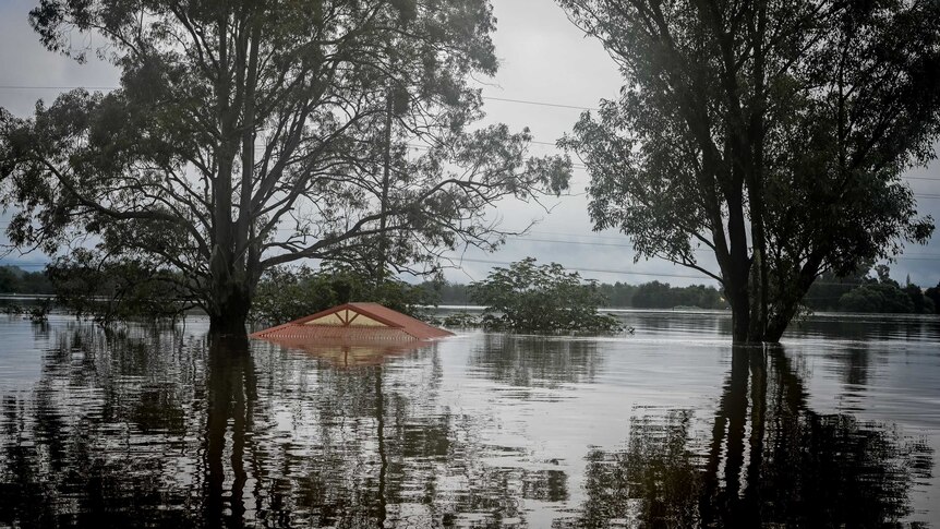 A house fully submerged by floodwaters in the Windsor area.