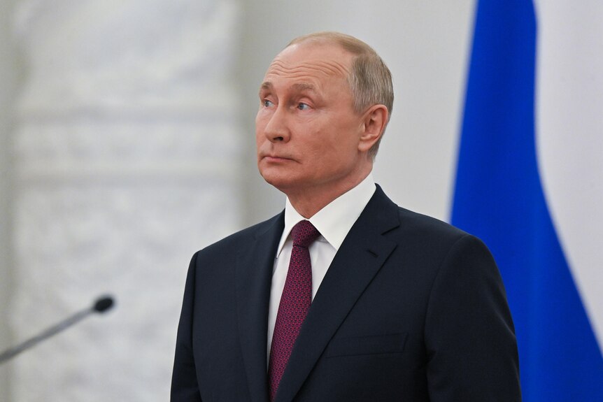 Vladimir Putin stands at an awarding ceremony in Moscow.