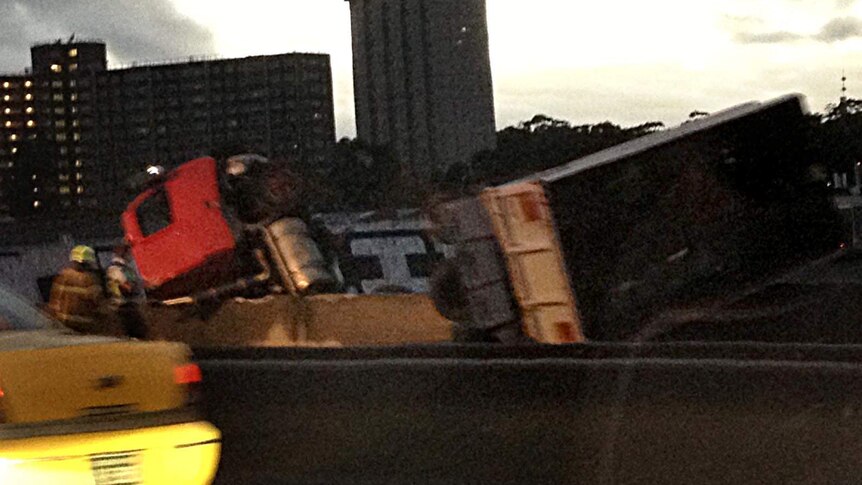 A truck hangs over the side of the Bolte Bridge.