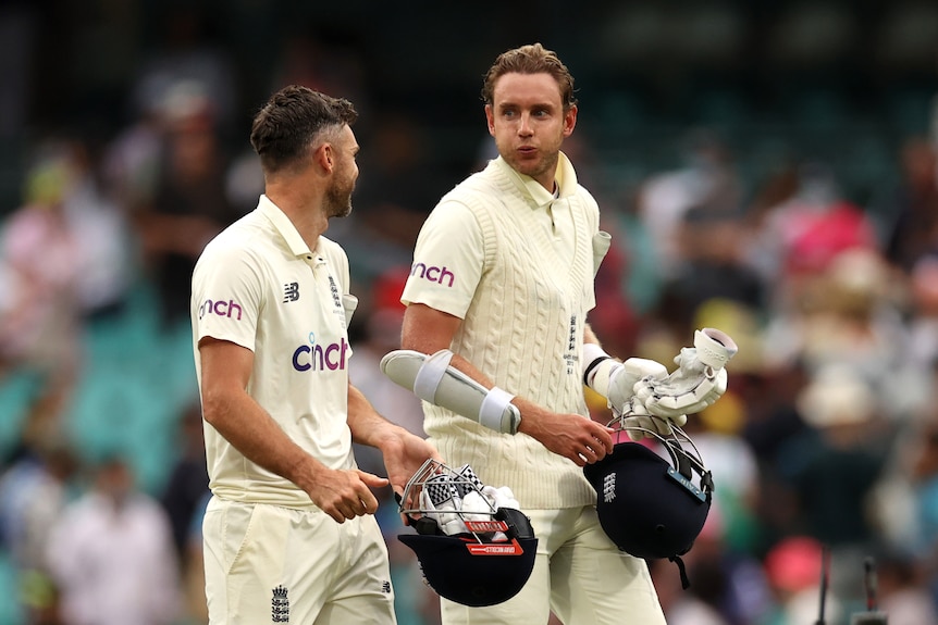 England batters Stuart Broad and James Anderson walk off the SCG after a draw in the fourth Ashes Test against Australia.
