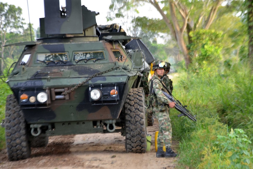 A Colombian soldier stands guard in the town of Tame, Arauca department.