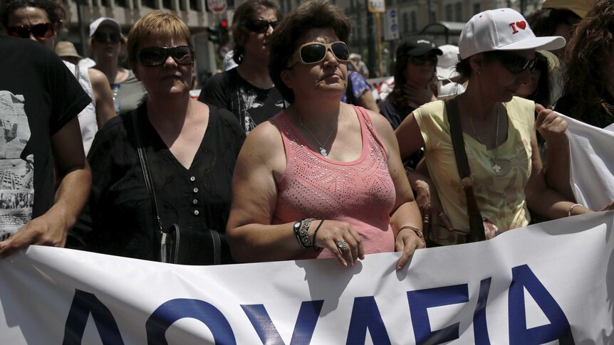 Protesters hold banner during a demonstration