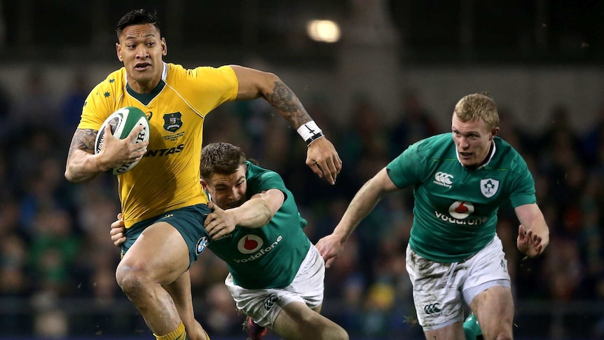 Irish victory ... Israel Folau tries to evade the tackle of Garry Ringrose
