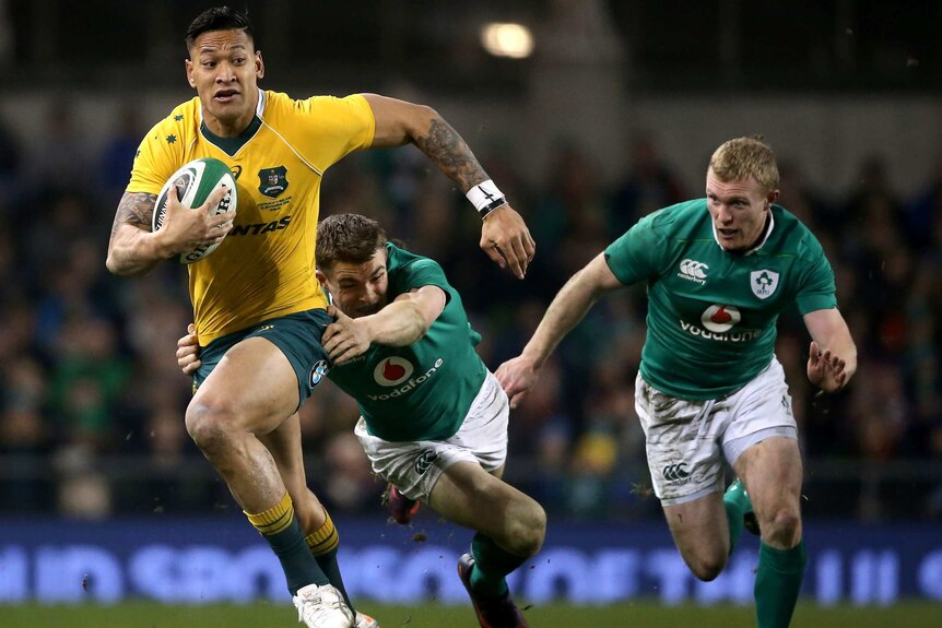 Irish victory ... Israel Folau tries to evade the tackle of Garry Ringrose