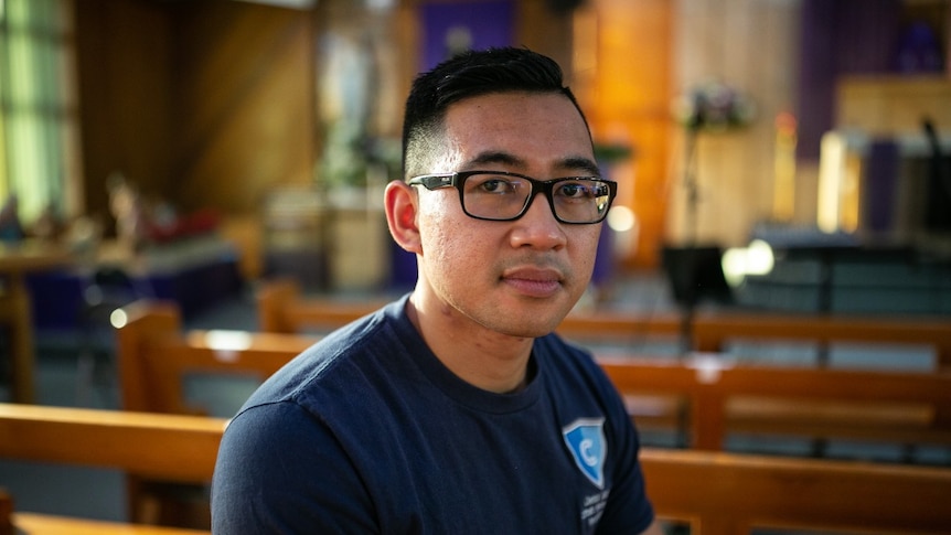 A man wearing black glasses.