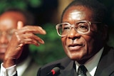 Zimbabwe President Robert Mugabe addresses a news conference in Durban in 1998.
