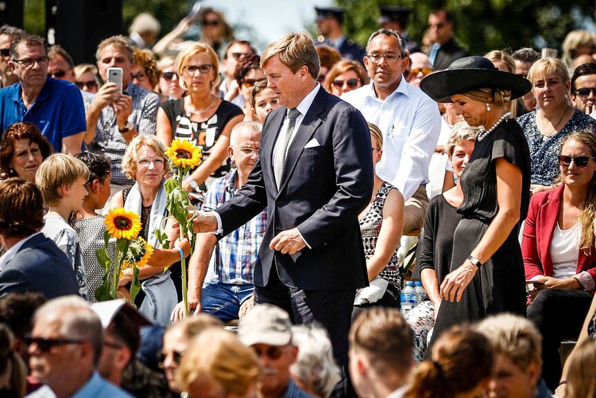King Willem-Alexander and his wife Queen Maxima of the Netherlands attend an MH17 memorial.