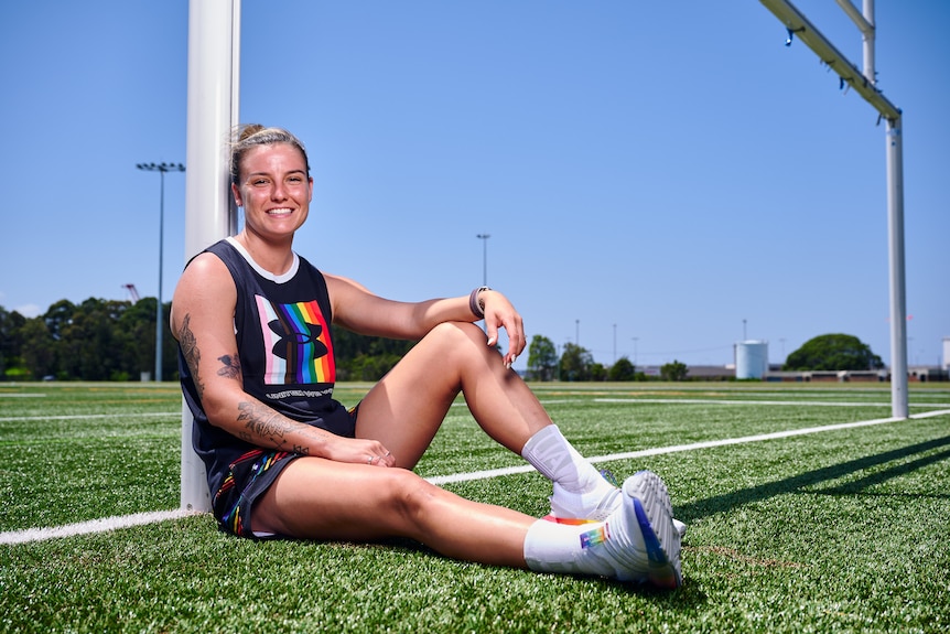 Chloe Logarzo of Australia poses for a photo wearing UnderArmour rainbow pride gear