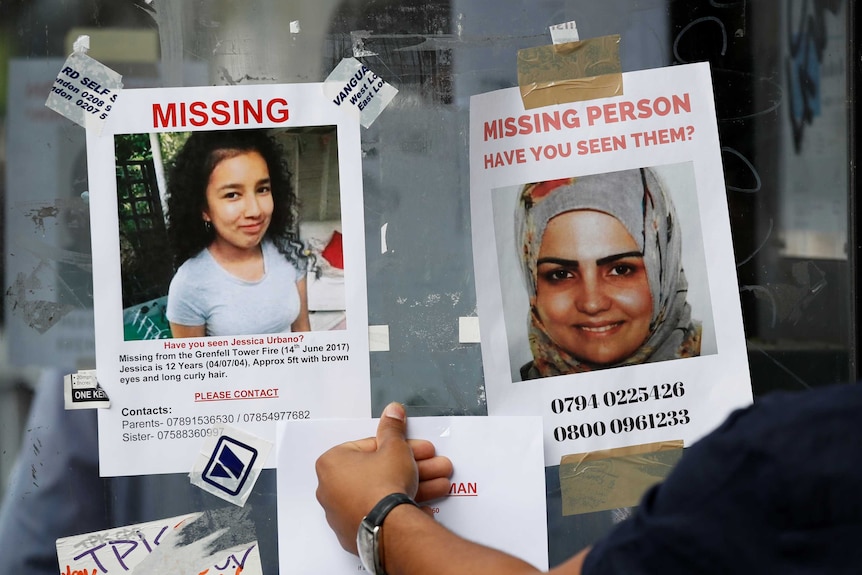 A hand appearing to stick a poster beneath two missing persons posters picturing a young woman and girl.