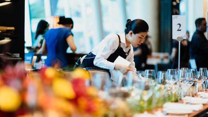 Women serves table