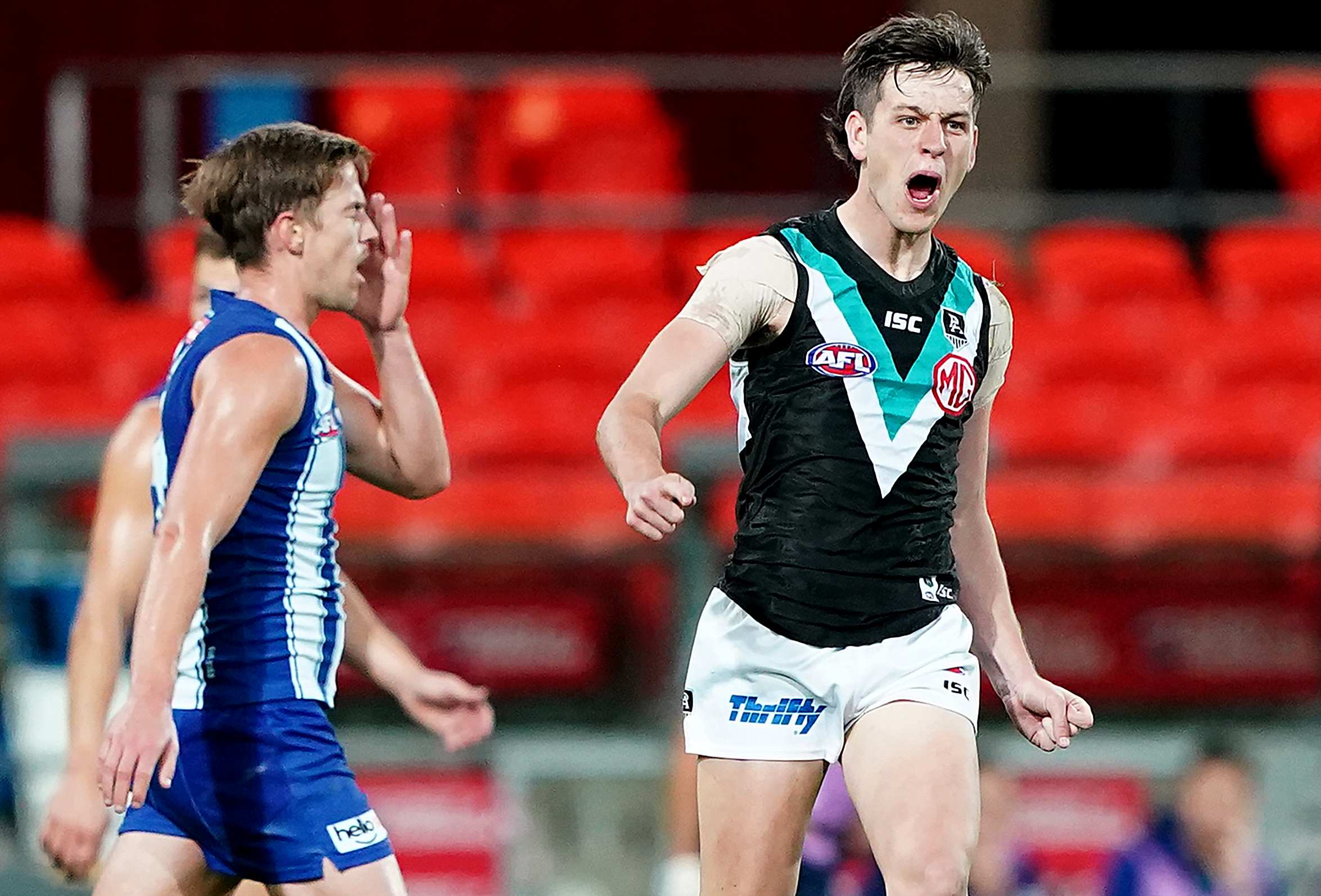 AFL ladder leader Port Adelaide beats North Melbourne by 36 points on the Gold Coast ABC News