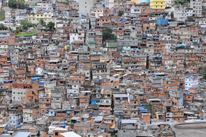 Tightly packed, box-like houses spill down the hillside of the Roccinha favela, in Rio de Janeiro, Brazil.