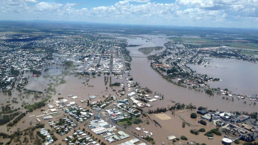 An aerial view of a flooded regional city.